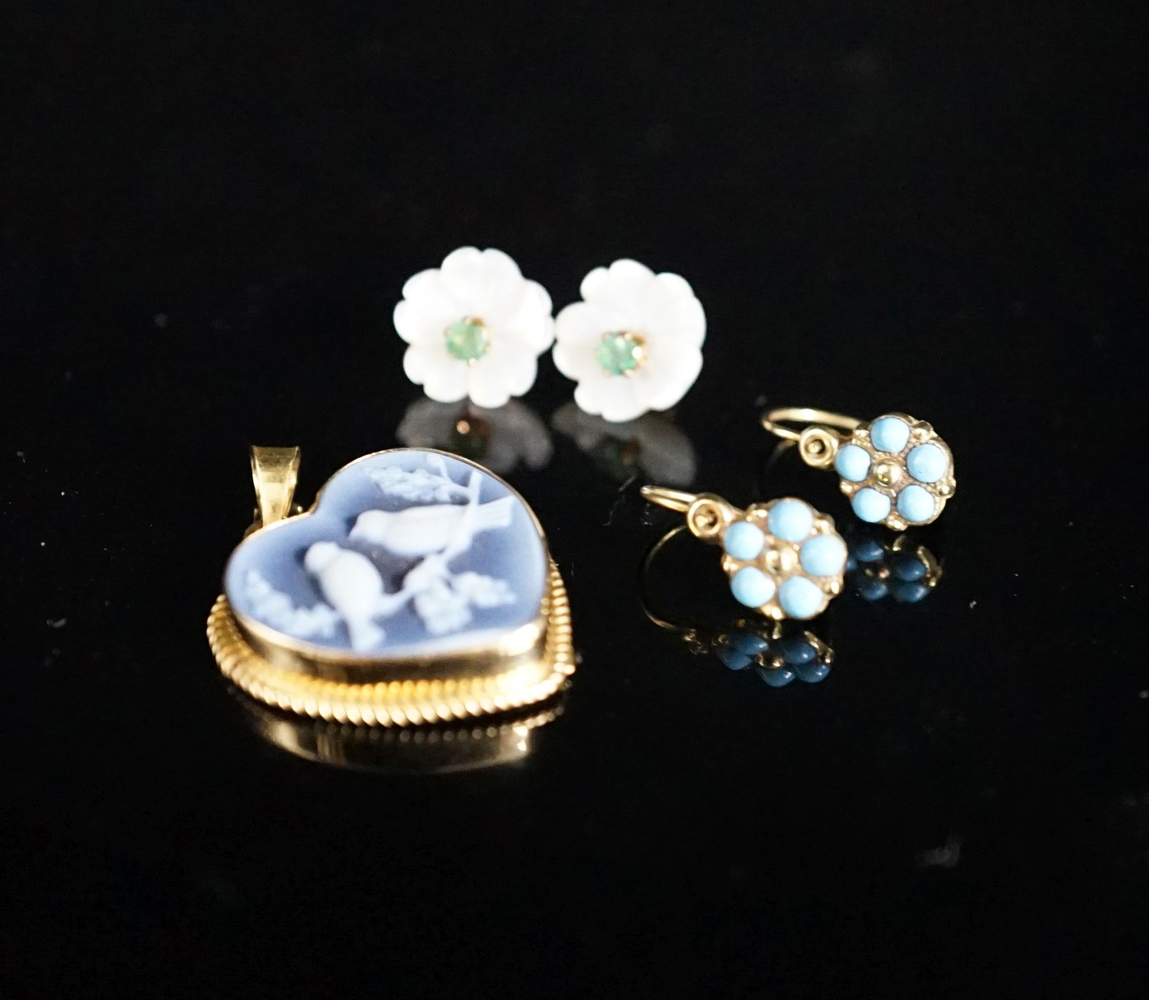 A modern Italian 750 mounted heart shaped glass pendant decorate with love birds, width 20mm, gross 3.4 grams and two pairs of yellow metal and gem set earrings.